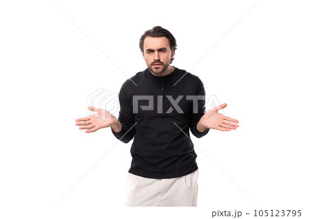 young brunette caucasian male model with beard dressed casual shrugs shoulders in ignorance young brunette caucasian male model with beard dressed casual shrugs shoulders in ignorance 105123795