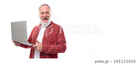 smart 60s middle aged mature man in a stylish shirt masters a laptop 105123850