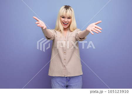 portrait of a pretty blonde european young woman stretching out her arms for a hug 105123910