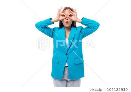 young attractive slim brunette model is dressed in a stylish business jacket. office fashion concept young attractive slim brunette model is dressed in a stylish business jacket. office fashion concept 105123930