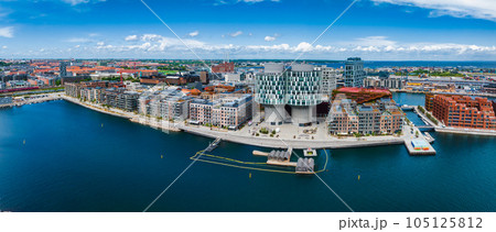 Aerial panorama of Indre Osterbro, Nordhavnen districts. New modern district in Copenhagen, Denmark. Beautiful modern buildings, Portland Towers and UN. Aerial panorama of Indre Osterbro, Nordhavnen districts. New modern district in Copenhagen, Denmark. Beautiful modern buildings, Portland Towers and UN. 105125812