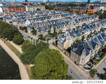Aerial view of the rooftops of Kartoffelraekkerne neighborhood, in Oesterbro, Copenhagen, Denmark. The neighbourhood built in the late 1800s for working class families Aerial view of the rooftops of Kartoffelraekkerne neighborhood, in Oesterbro, Copenhagen, Denmark. The neighbourhood built in the late 1800s for working class families 105125842