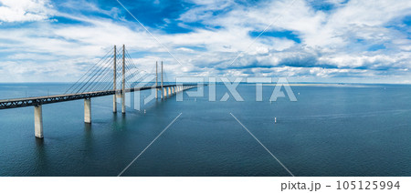 Panoramic aerial close up view of Oresund bridge over the Baltic sea between Malmo city in Sweden and Copenhagen in Denmark. 105125994