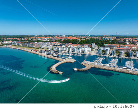 View of the Helsinborg city centre and the port of Helsingborg in Sweden. Old town by the beach and city port in Helsingborg harbour. Beautiful aerial view. 105126007