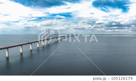 Panoramic aerial close up view of Oresund bridge over the Baltic sea between Malmo city in Sweden and Copenhagen in Denmark. 105126179