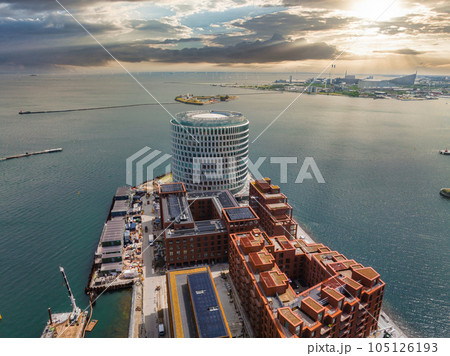 Aerial panorama of Indre Osterbro, Nordhavnen districts. New modern district in Copenhagen, Denmark. Beautiful modern buildings, Portland Towers and UN. Aerial panorama of Indre Osterbro, Nordhavnen districts. New modern district in Copenhagen, Denmark. Beautiful modern buildings, Portland Towers and UN. 105126193