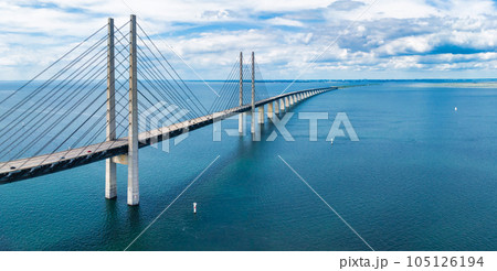 Panoramic aerial close up view of Oresund bridge over the Baltic sea between Malmo city in Sweden and Copenhagen in Denmark. 105126194