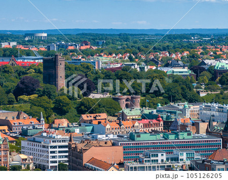 View of the Helsinborg city centre and the port of Helsingborg in Sweden. Old town by the beach and city port in Helsingborg harbour. Beautiful aerial view. 105126205