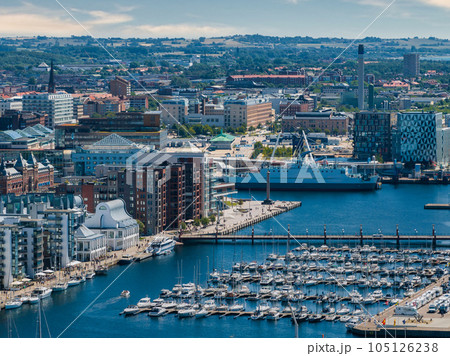 View of the Helsinborg city centre and the port of Helsingborg in Sweden. Old town by the beach and city port in Helsingborg harbour. Beautiful aerial view. 105126238