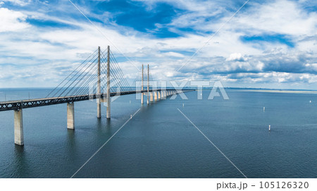 Panoramic aerial close up view of Oresund bridge over the Baltic sea between Malmo city in Sweden and Copenhagen in Denmark. Panoramic aerial close up view of Oresund bridge over the Baltic sea between Malmo city in Sweden and Copenhagen in Denmark. 105126320