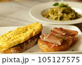 Breakfast set. Delicious sandwich - omelette and smoked ham with honey  on toasted bread. 105127575