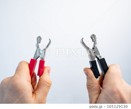 Hands with crocodile alligator clip Hands with crocodile alligator clip 105129130