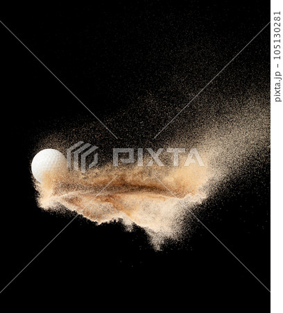 Golf ball explode from sand bunker. Golfer hit ball sand explosion in mid air. Golf club hit ball tee in sand bunker explosion. Black background isolated freeze motion Golf ball explode from sand bunker. Golfer hit ball sand explosion in mid air. Golf club hit ball tee in sand bunker explosion. Black background isolated freeze motion 105130281
