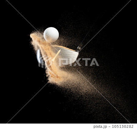 Golf ball tee explode from sand bunker. Golfer hit ball with club to sand explosion to green. Golf club hit ball tee in sand bunker explosion. Black background isolated freeze motion Golf ball tee explode from sand bunker. Golfer hit ball with club to sand explosion to green. Golf club hit ball tee in sand bunker explosion. Black background isolated freeze motion 105130282