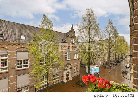 an outside area with flowers and buildings in the fore - image was taken from my hotel room at amsterdam, netherlands an outside area with flowers and buildings in the fore - image was taken from my hotel room at amsterdam, netherlands 105131402