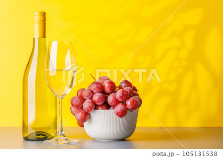 Wine bottle and grapes 105131538