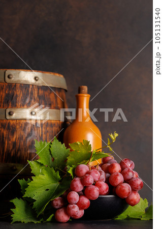 Wine bottle and grapes 105131540