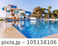 Empty small aquapark sliders with pool and palm trees at the morning, Tunisia 105138106