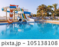Empty small aquapark sliders with pool and palm trees at the morning, Tunisia 105138108