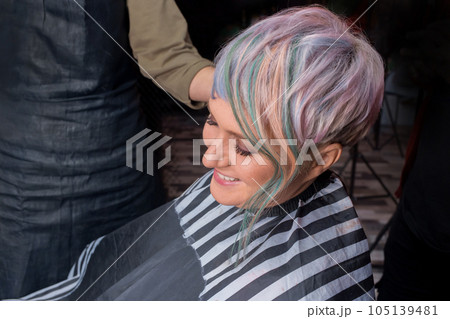 Smiling satisfied adult woman European barbershop customer with stylish, fashion creative color bob hair coloring 105139481
