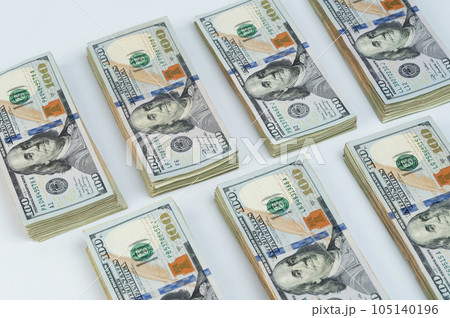 Many piles of 100 USA dollar billls 105140196