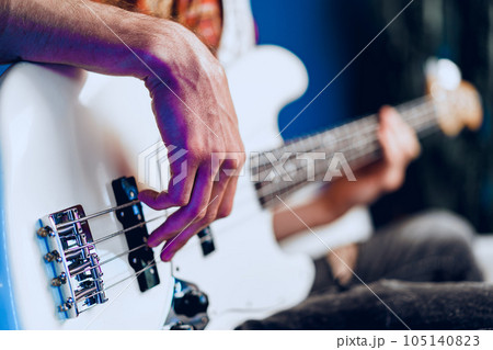 Close up photo of male hands playing guitar Close up photo of male hands playing guitar 105140823