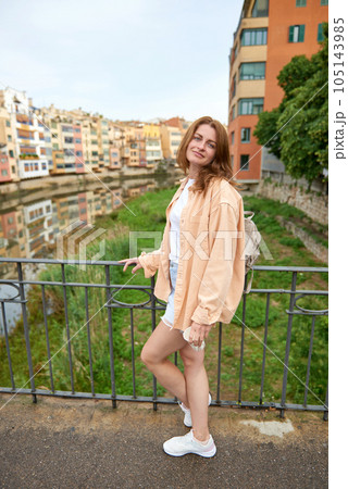 Tourist beautiful woman in Girona, Catalonia, Spain near of Barcelona. Famous resort destination in Costa Brava. Portrait of sexy woman posing at the town. Beautiful girl on the empty street in old Tourist beautiful woman in Girona, Catalonia, Spain near of Barcelona. Famous resort destination in Costa Brava. Portrait of sexy woman posing at the town. Beautiful girl on the empty street in old 105143985