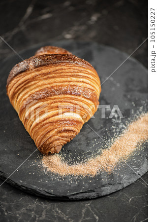 Crispy butter and cinnamon sugar croissant 105150227