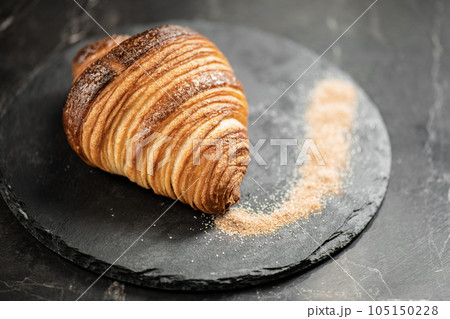 Crispy butter and cinnamon sugar croissant Crispy butter and cinnamon sugar croissant 105150228