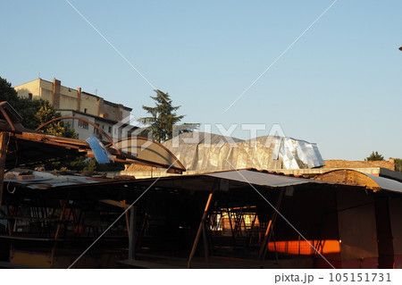 Aftermath of the hurricane 07,19,23 Sremska Mitrovica, Serbia. An aluminum sheet, a ripped roof that flew off onto a brick building. Metal decking sheet. State of emergency after a catastrophic storm 105151731