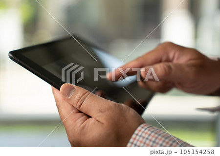 Man hands using looking and touch tablet laptop and cellphone communication mockup computer technology for tablet digital screen blank cyberspace online occupation internet 105154258