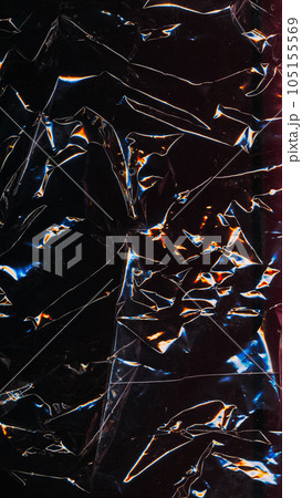 Grunge texture. Old film. Abstract background. Wrinkled black paper with yellow blue neon glowing glitch pattern on dark light shadow. Grunge texture. Old film. Abstract background. Wrinkled black paper with yellow blue neon glowing glitch pattern on dark light shadow. 105155569