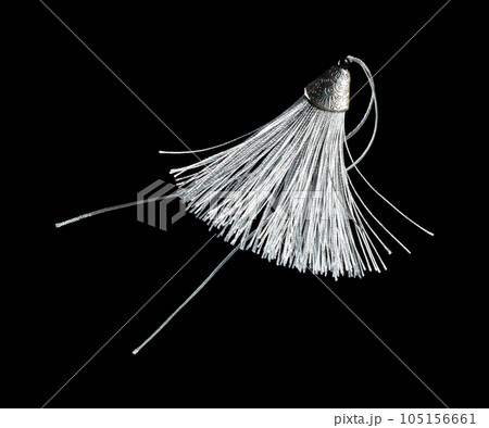 Silver Silk Tassel for decorating. Indian culture hang Tassel for moving wind blow and elegance look. Tassel has many color spinning in air. Black background isolated freeze motion Silver Silk Tassel for decorating. Indian culture hang Tassel for moving wind blow and elegance look. Tassel has many color spinning in air. Black background isolated freeze motion 105156661