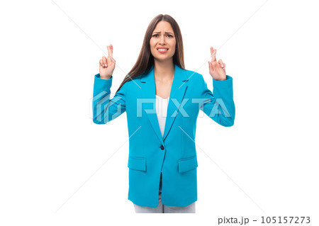young office worker woman with black straight hair in a blue business jacket reports the news on a 105157273