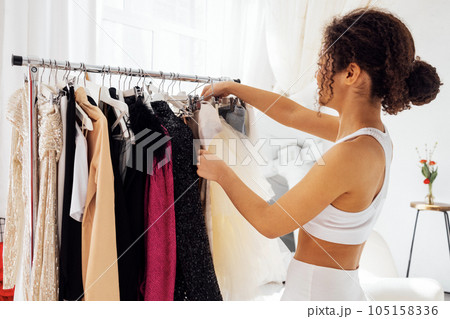 Charming smiling cute african girl in white top and leggings by trempels with stylish clothes Charming smiling cute african girl in white top and leggings by trempels with stylish clothes 105158336