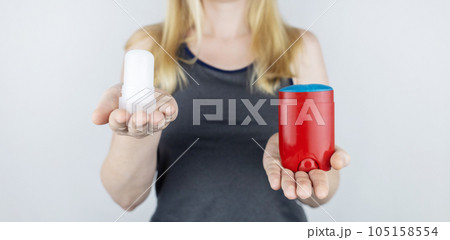 left or right. Girl chooses between eco-friendly deodorant without toxins and antiperspirant with toxic elements. In left hand Mineral alum crystal stick, in right hand classic remedy chemical nature left or right. Girl chooses between eco-friendly deodorant without toxins and antiperspirant with toxic elements. In left hand Mineral alum crystal stick, in right hand classic remedy chemical nature 105158554