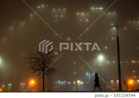 Misty cityscape with lanterns at night 105159594