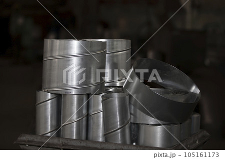 Metal stainless ventilation pipes at a metallurgical plant. Rolled metal. Metal stainless ventilation pipes at a metallurgical plant. Rolled metal. 105161173