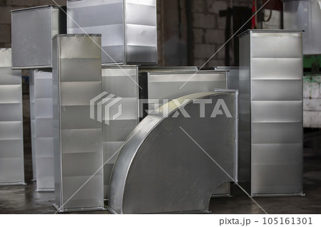 Metal stainless ventilation pipes at a metallurgical plant. Rolled metal. Metal stainless ventilation pipes at a metallurgical plant. Rolled metal. 105161301
