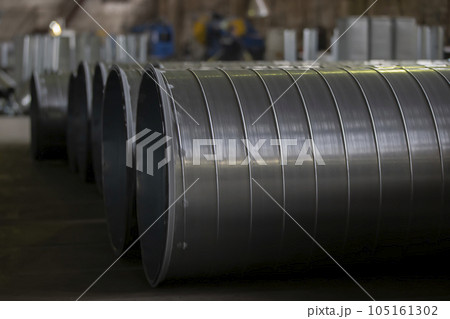 Metal stainless ventilation pipes at a metallurgical plant. Rolled metal. Metal stainless ventilation pipes at a metallurgical plant. Rolled metal. 105161302