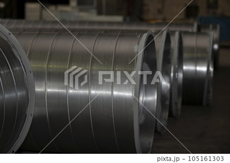 Metal stainless ventilation pipes at a metallurgical plant. Rolled metal. Metal stainless ventilation pipes at a metallurgical plant. Rolled metal. 105161303