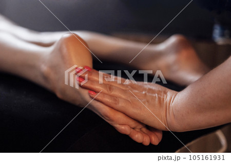 Close up of female foot getting gentle massage. Close up of female foot getting gentle massage. 105161931