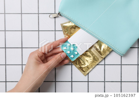 A bag with condoms and birth control pills A bag with condoms and birth control pills 105162397