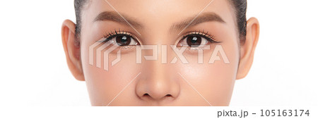 Close-up shot of beautiful Asian woman's eyes on white background. Close-up shot of beautiful Asian woman's eyes on white background. 105163174