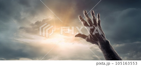 Zombie hand rising out of a graveyard in spooky night. Halloween concept Zombie hand rising out of a graveyard in spooky night. Halloween concept 105163553