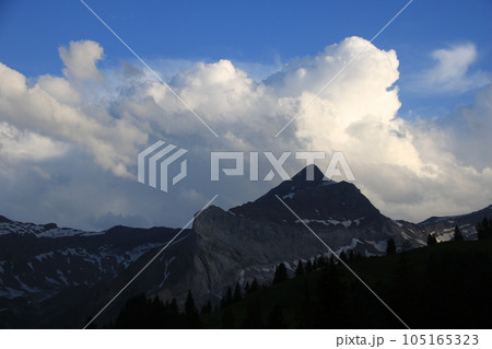 Bright lit cumulus cloud over Mount Oldehore. Bright lit cumulus cloud over Mount Oldehore. 105165323
