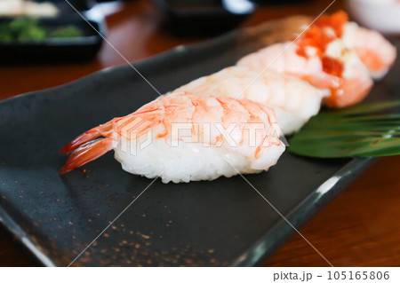 sushi or shrimp sushi or shrimp rolls, rice topped with shrimp or prawn rolls and salmon rolls sushi or shrimp sushi or shrimp rolls, rice topped with shrimp or prawn rolls and salmon rolls 105165806