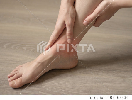 Young woman has pain in her legs Young woman has pain in her legs 105168436