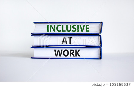 Inclusive at work symbol. Books with words 'Inclusive at work' on beautiful white background. Business, inclusive at work concept. Copy space. Inclusive at work symbol. Books with words 'Inclusive at work' on beautiful white background. Business, inclusive at work concept. Copy space. 105169637