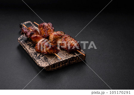 Delicious grilled chicken, turkey or pork skewers with salt, spices and herbs 105170291